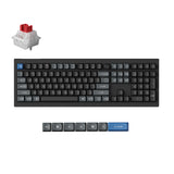 A black mechanical keyboard shown on a white background, with a small inset of a switch and a row of keycap close-ups below. The keyboard has mostly black and gray keycaps, with a blue Enter key and a blue letter key.